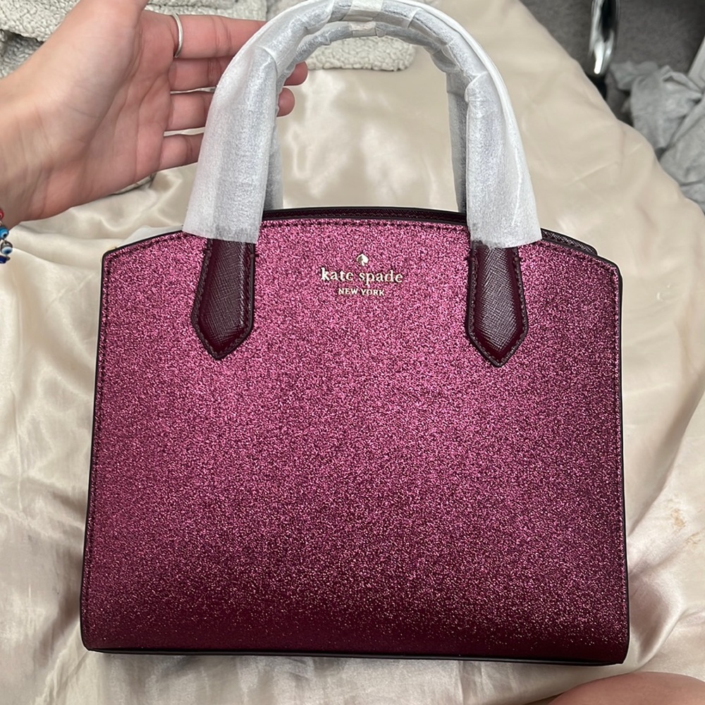 Kate spade deep berry crossbody satchel. Glittery finish. Brand new with tags.